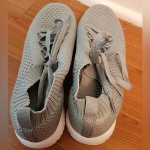 Brand new, never worn women’s casual athletic sneakers in a light grey color
